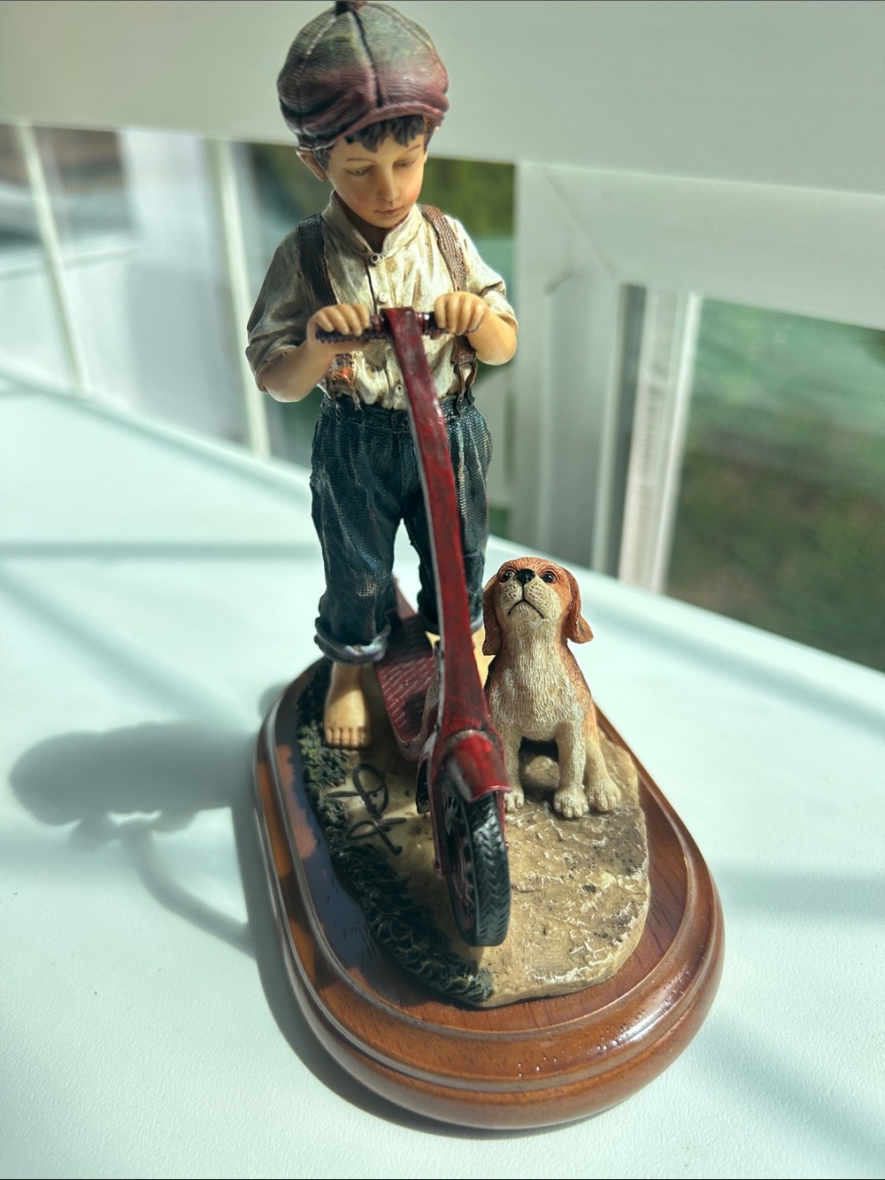 handcrafted "Go Home" figurine by Jim Daly for Vanmark